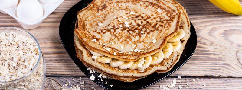 Banana and oat pancakes topped with banana slices