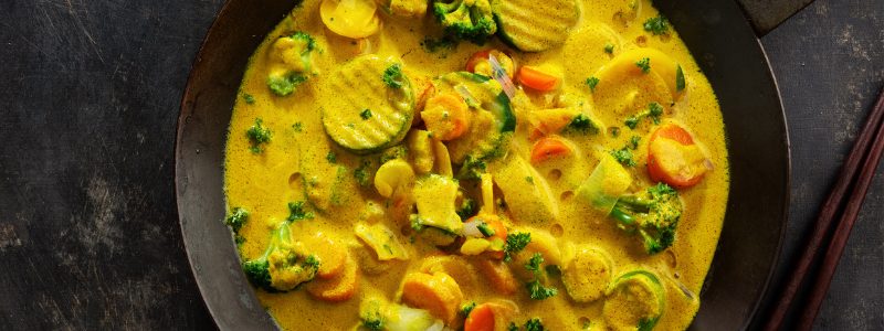 Vegan curry with vegetables in pan
